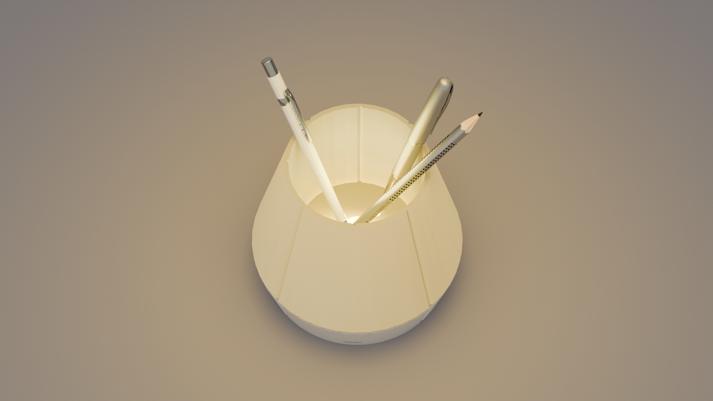 The top view of Litele Duo Marble lamp, lit and functioning as a pen holder, with pens inserted