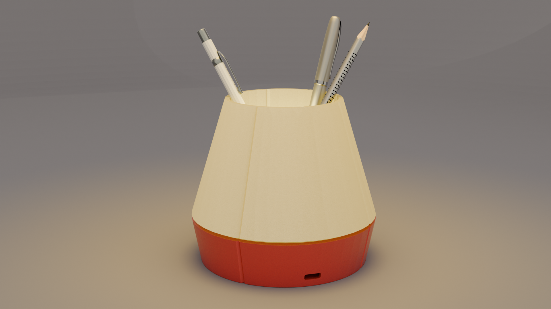 The Litele Duo Red lamp, lit and functioning as a pen holder, with pens inserted