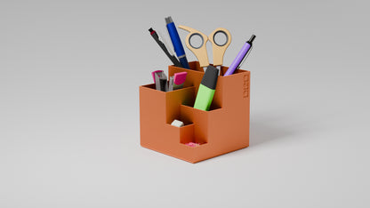 Durable orange pen holder with various slots for organizing pens, markers, and supplies