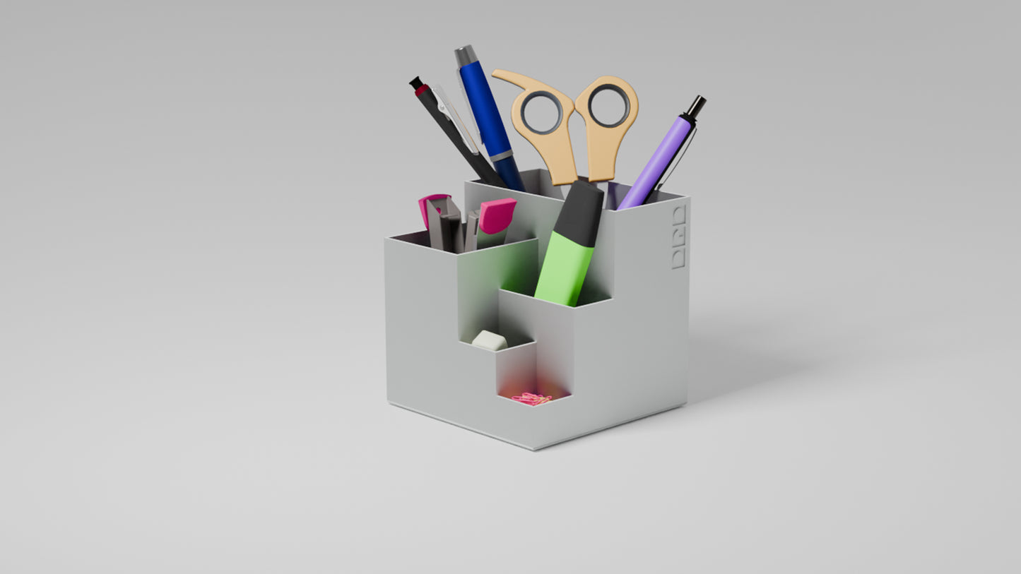 Organised white penholder with stationery items in it.